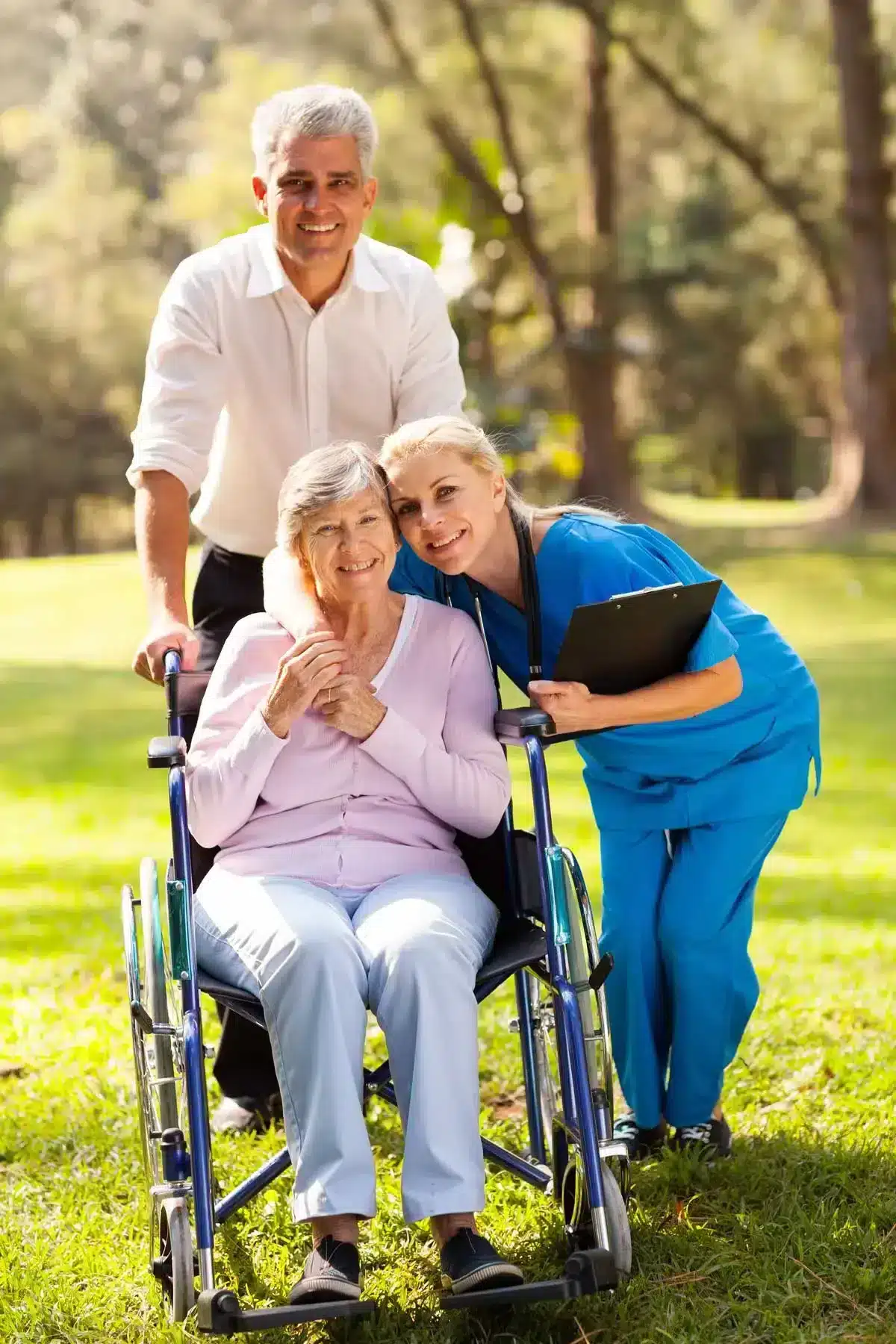 Memory care residents and caregivers outdoors