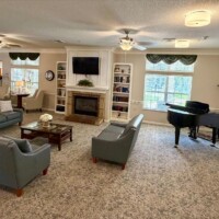Navion of New Bern fireplace and piano
